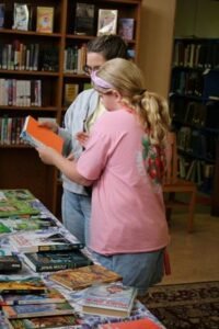 Pictured: A family looking at books during the book swap.