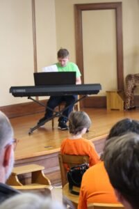 Pictured: A performance from the youth keyboard recital at the Carnegie Library in Albany, Oregon.